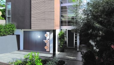 Portillon pour porte de garage sectionnelle