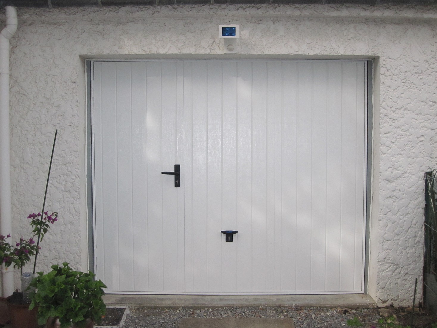Porte de garage avec porte coulissante
