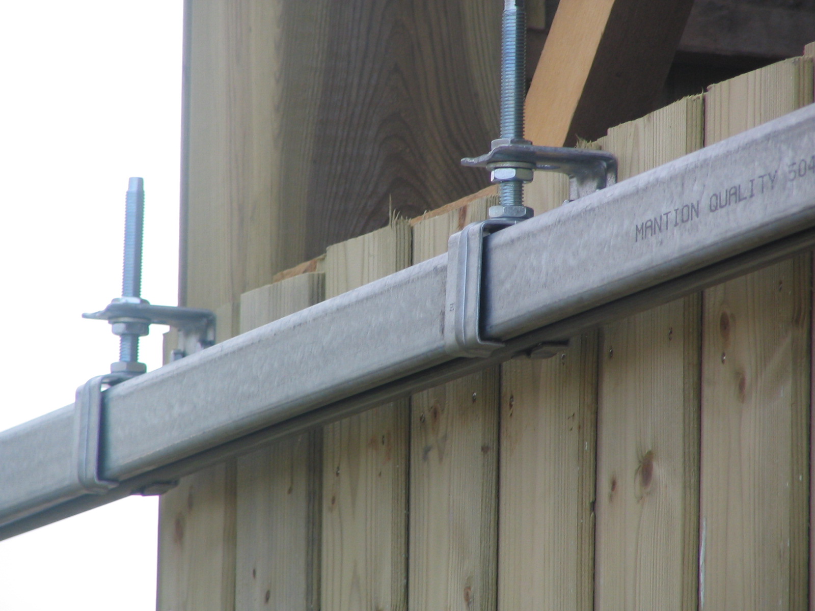 Glissiere pour porte de garage coulissante