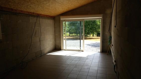 Remplacement porte de garage par baie coulissante avec volet roulant