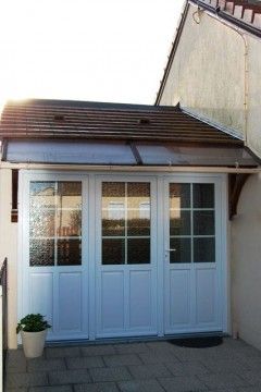 Remplacement d'une porte de garage par une baie vitrée