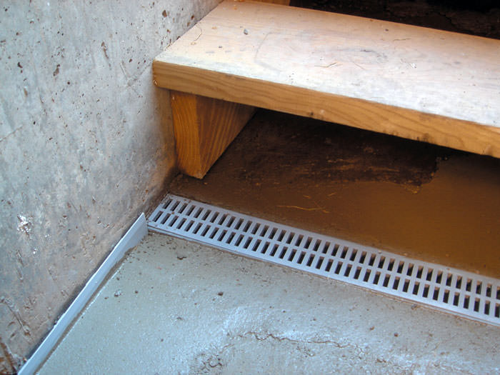Drain devant porte de garage