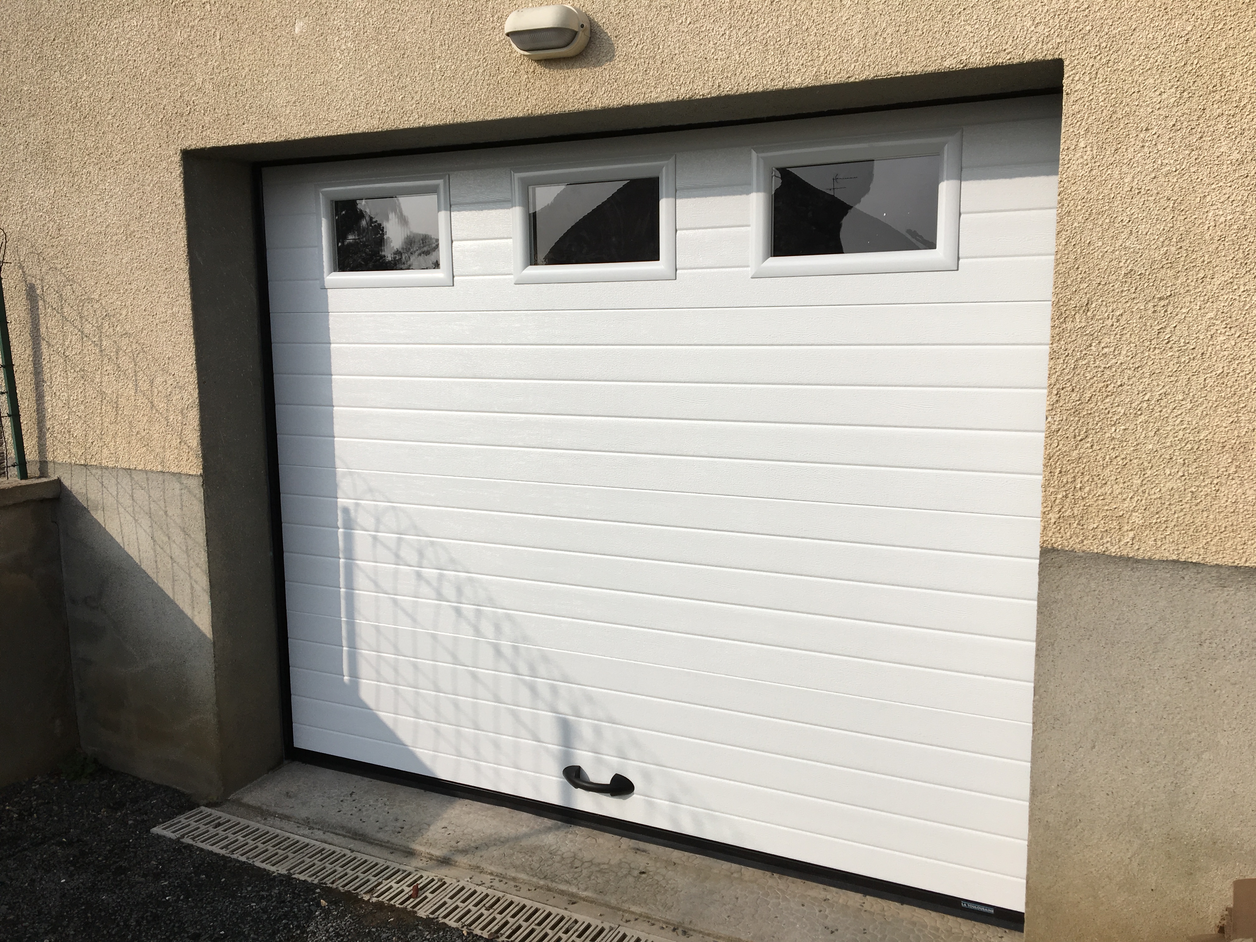 Tablier porte de garage sectionnelle