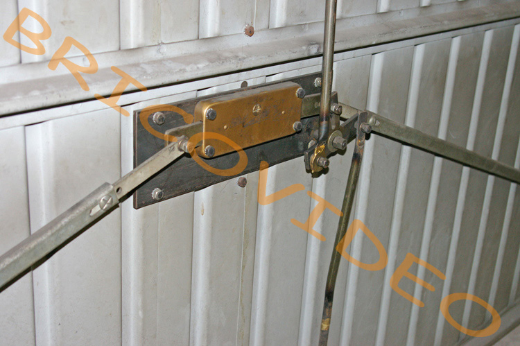 Système fermeture porte de garage basculante