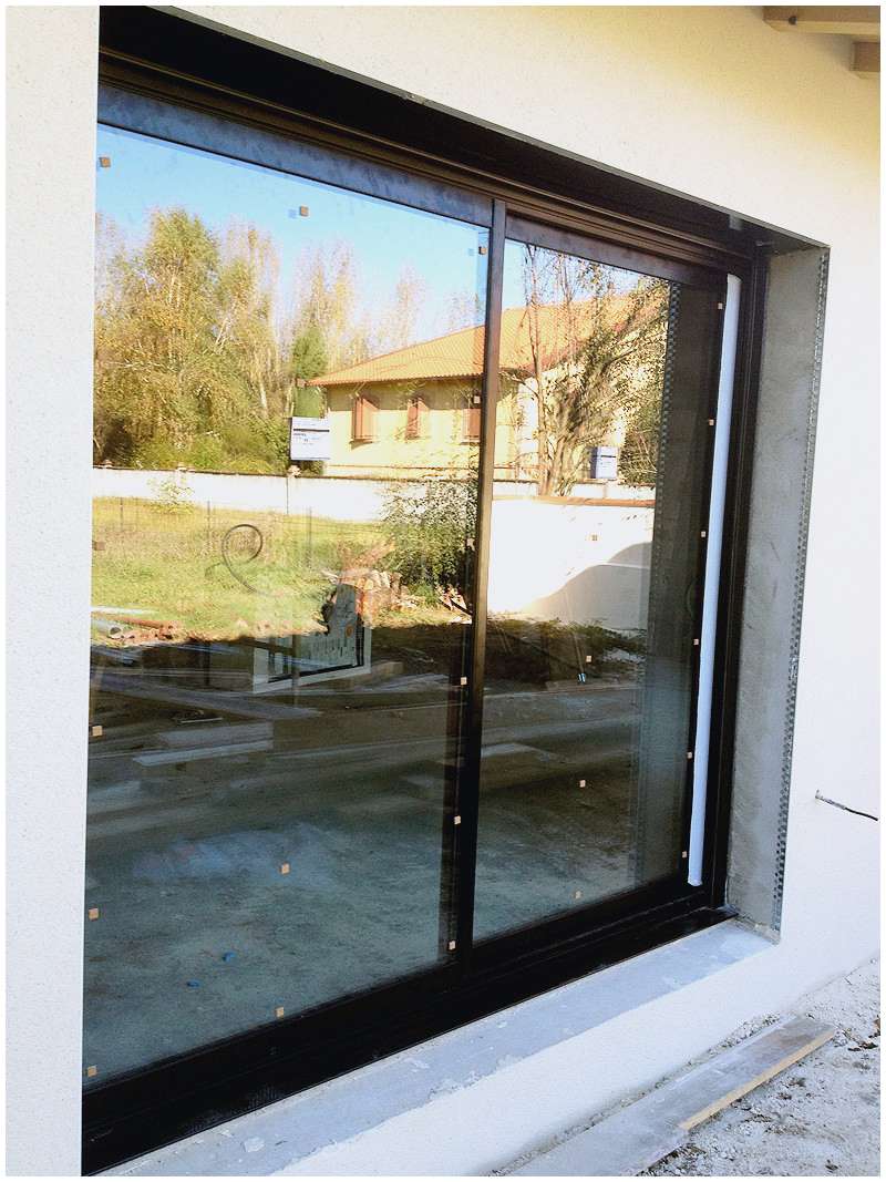 Porte de garage coulissante vitrée