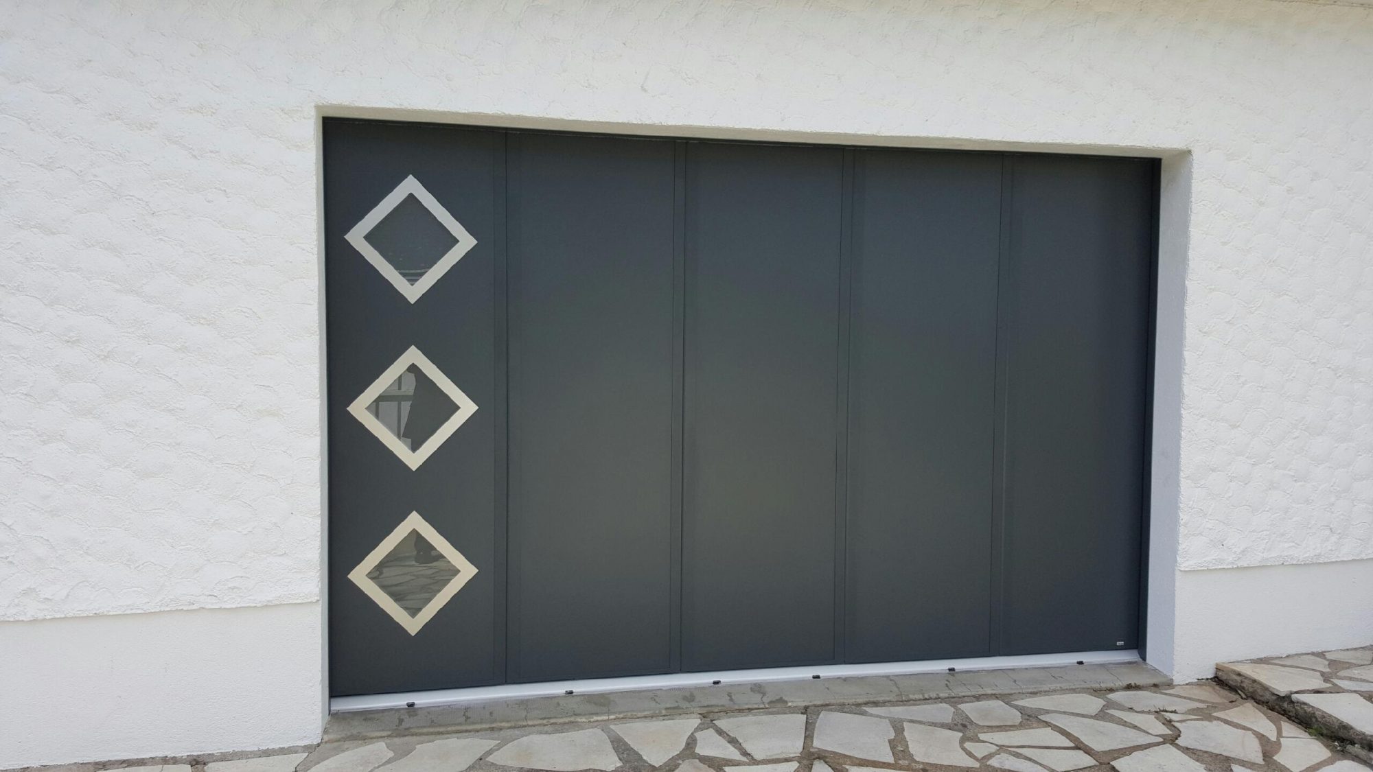 Porte de garage coulissante ou sectionnelle