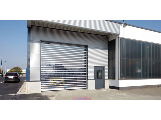 Porte de garage sectionnelle ou a enroulement