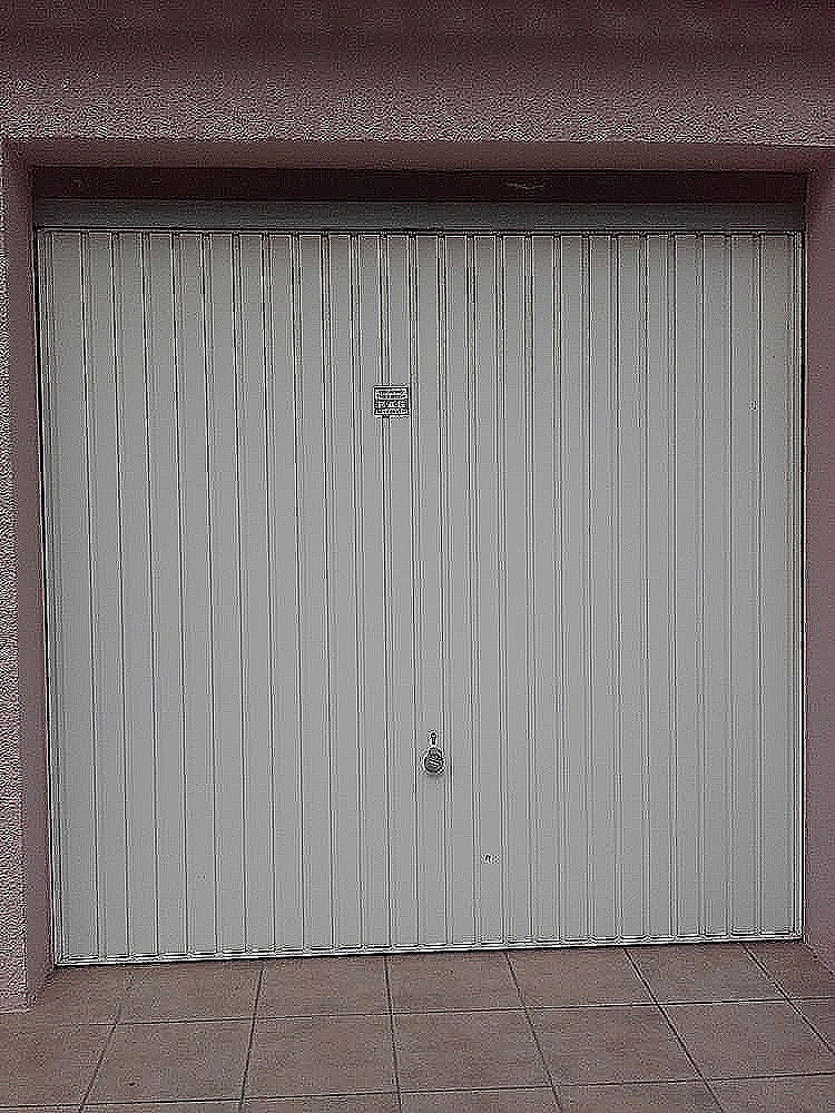 Pose porte coulissante de garage